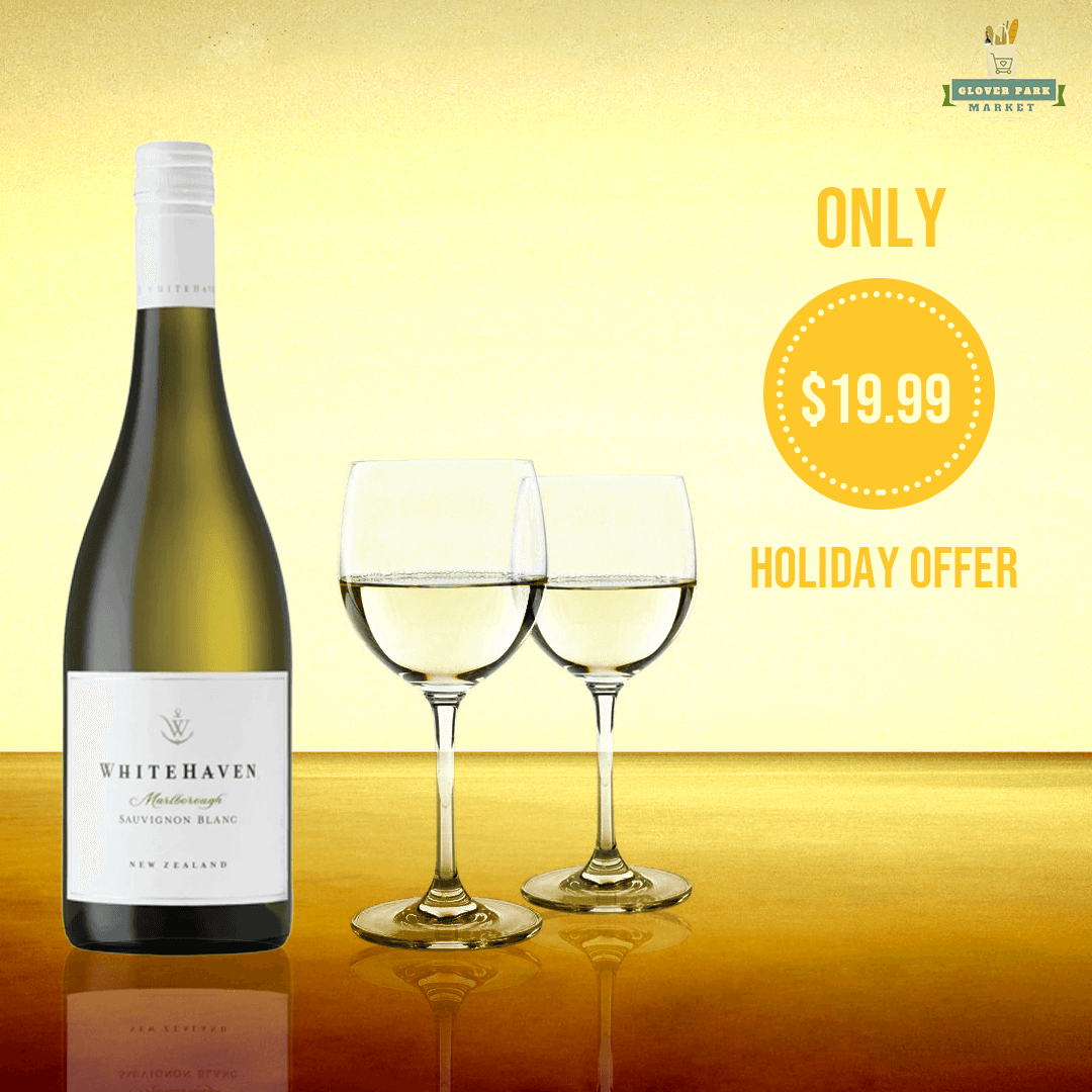 A promotional graphic for White Haven wine, showing the bottle with a coastal background.